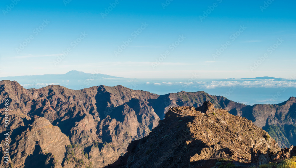 Landscape in the volcanic crater Caldera de Taburiente Natoional Park seen from mountain peak of Roque de los Muchachos Viewpoint, island La Palma, Canary Islands, Spain
