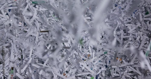 Shredded office paper fills frame viewed from above