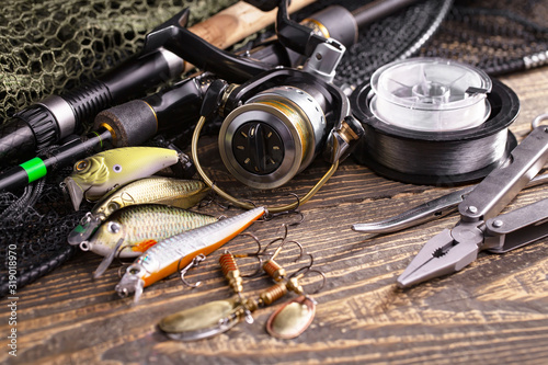 fishing tackle on a wooden table.