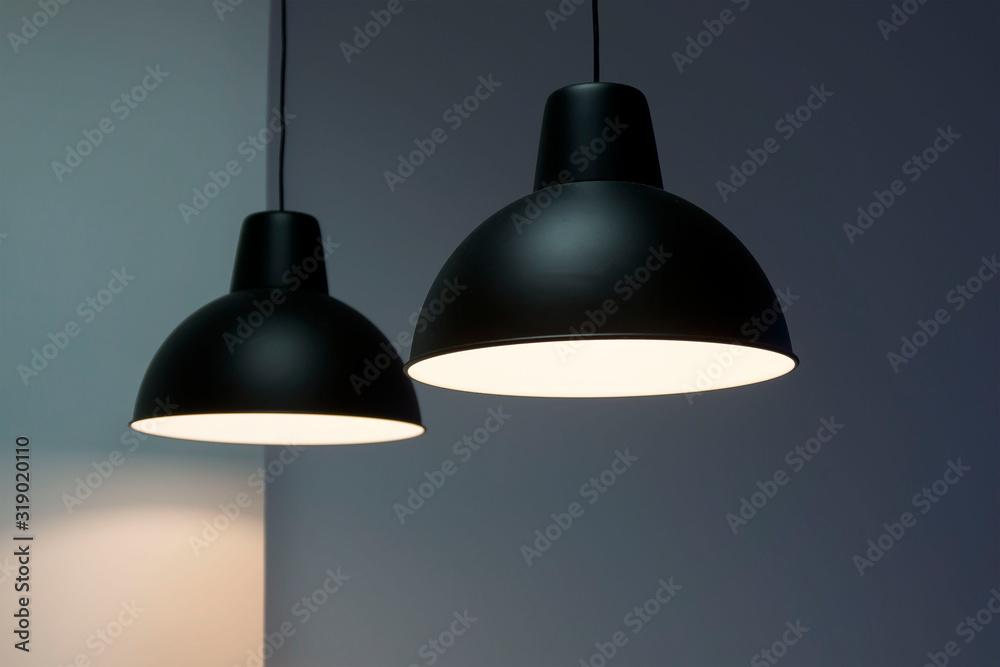 Black decorative lamp hanging from the ceiling.modern lamp isolated on white background Black decorative lamp hanging from the ceiling.modern lamp isolated on white background