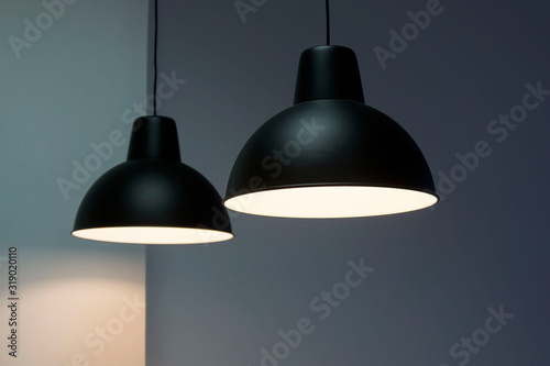 Фотография Black decorative lamp hanging from the ceiling