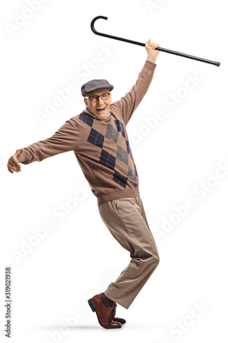 Elderly man dancing with his walking cane up