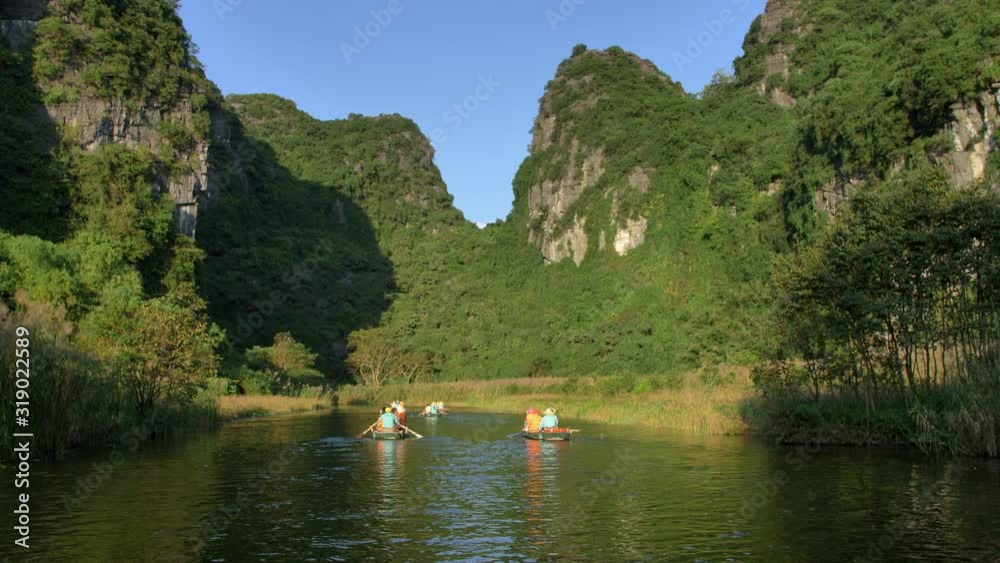 Boats on a river in Ninh Binh, Vietnam Boats on a river in Ninh Binh, Vietnam
