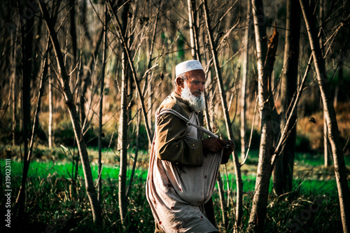 Farmer Fertilizing The Farm