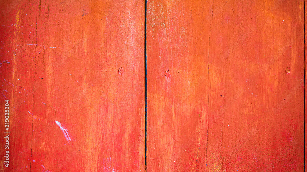 Fototapeta premium Old red painted board background. Wood panels on a rustic barn