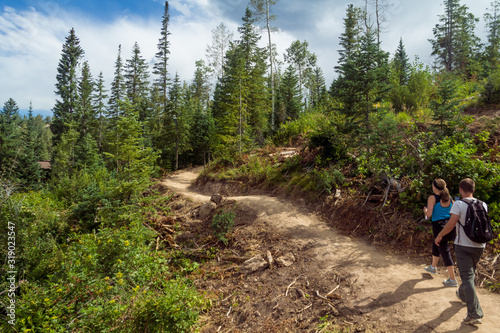 Man and woman hiking Mt Werner in Steamboat Springs in the summer photo