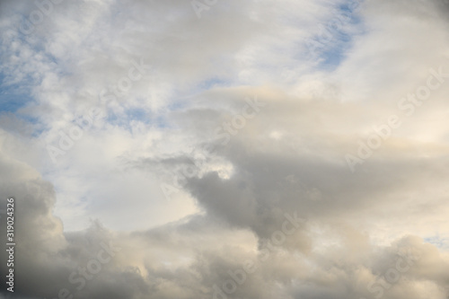 Dramatic afternoon blue sky with white and gray clouds as a nature background