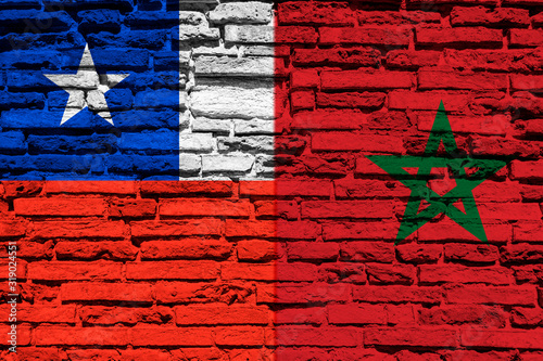 Flag of Chile and Morocco on brick wall