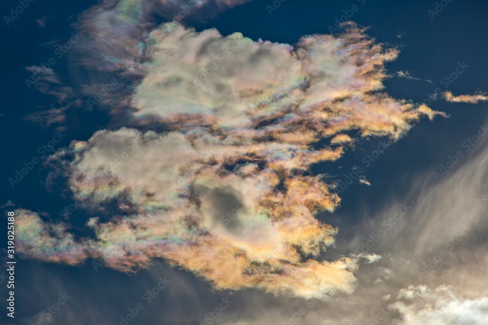 contrasting clouds reflect bright sunlight. bright sky at noon. contrasting clouds reflect bright sunlight. bright sky at noon.