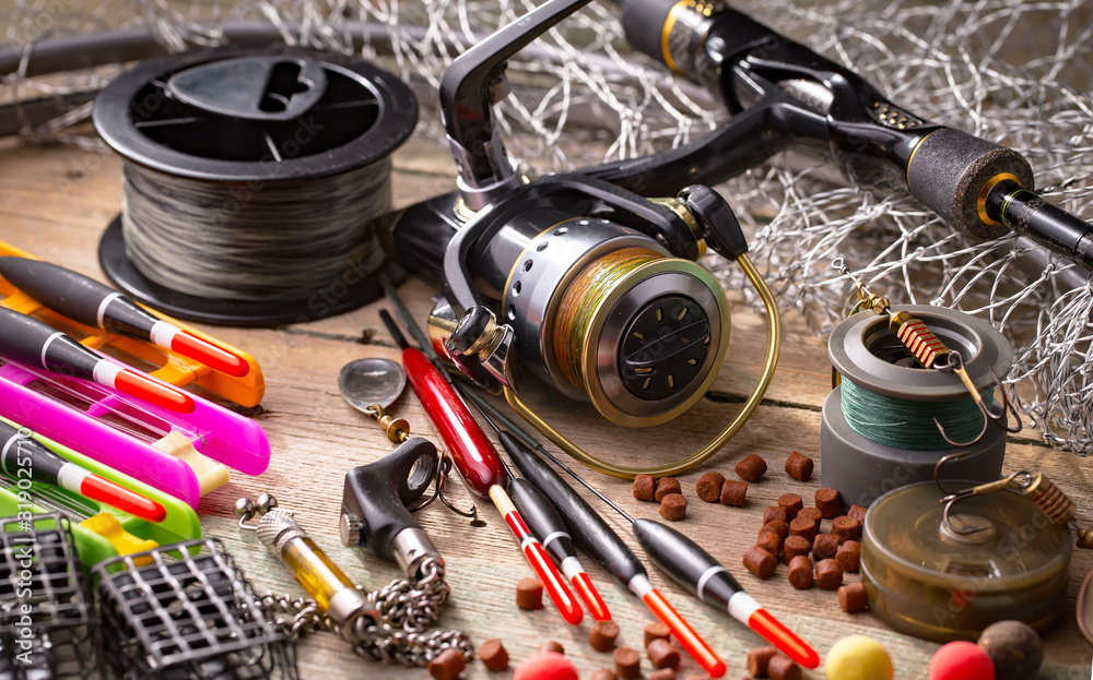 Spinning and fishing rods on an old background Spinning and fishing rods on an old background