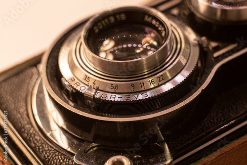 Close up on old vintage analogue photo camera on film  © Oliver