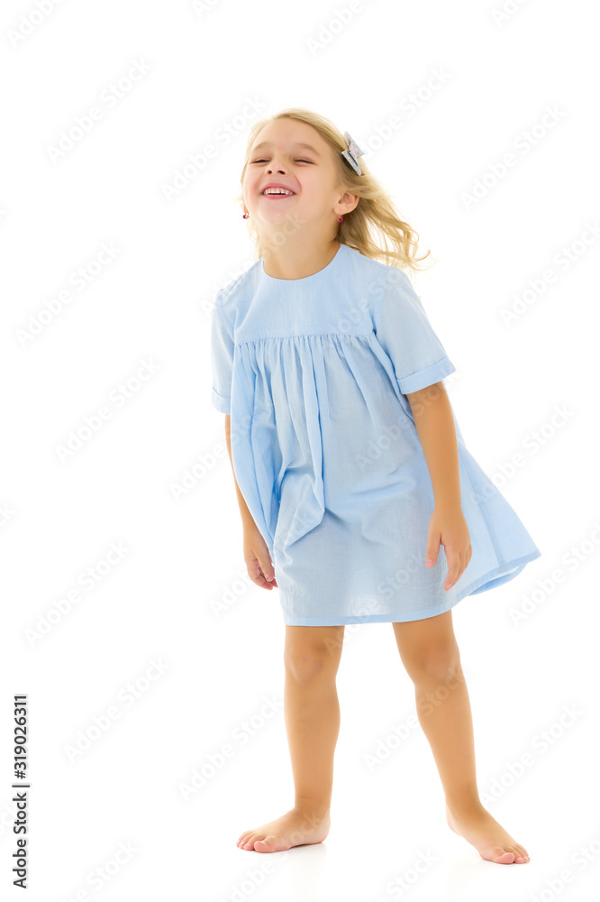 Little girl in an elegant dress.The concept of a happy childhood Little girl in an elegant dress.The concept of a happy childhood