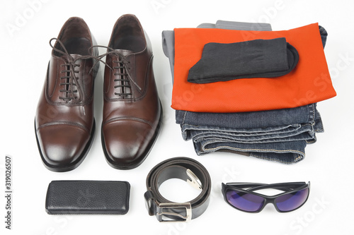 Classic men's shoes, belt, glasses, clothes and mobile phone on white background