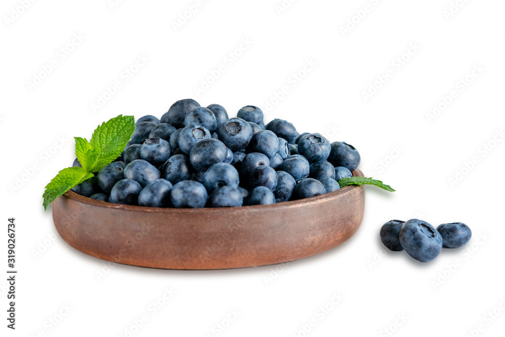 Plate with blueberries closeup and a leaf of mint isolated on a white background. Vitamin bilberry nutrition to improve vision and health. Healthy food for children and adults Plate with blueberries closeup and a leaf of mint isolated on a white background. Vitamin bilberry nutrition to improve vision and health. Healthy food for children and adults