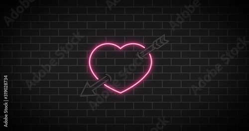 Neon sign.Heart sign on brick background.