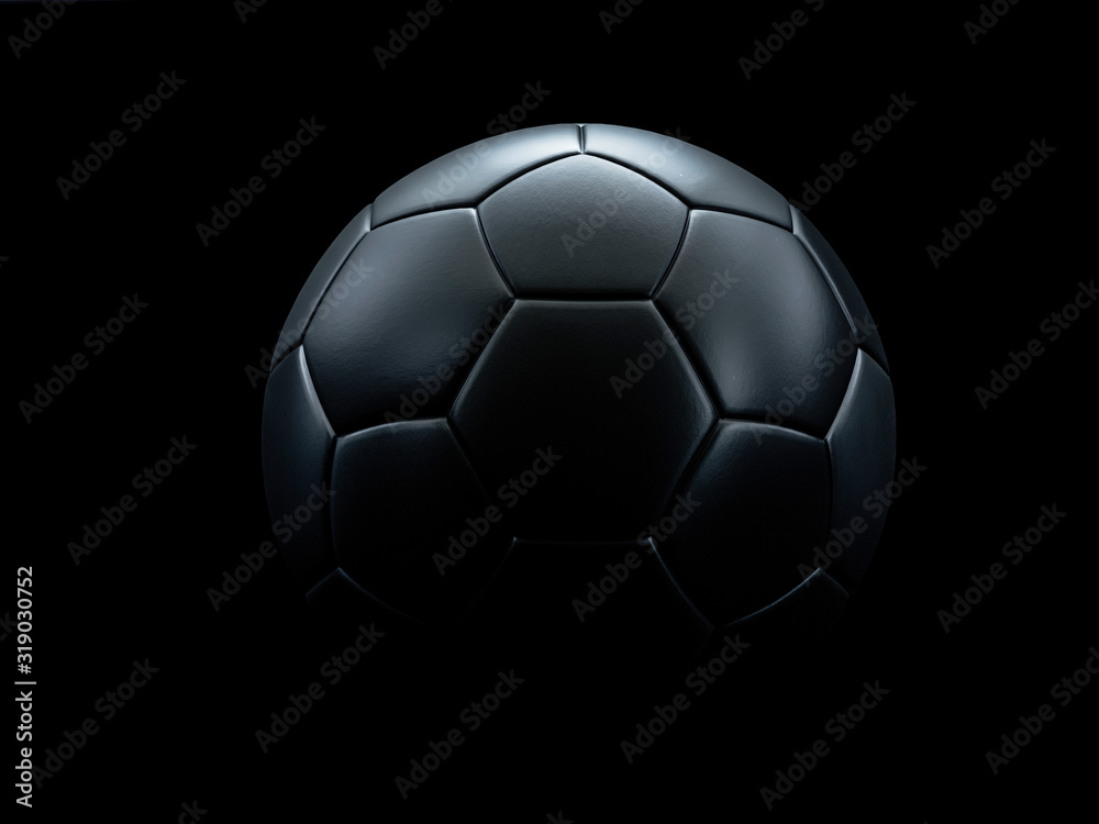 Black football against black background.