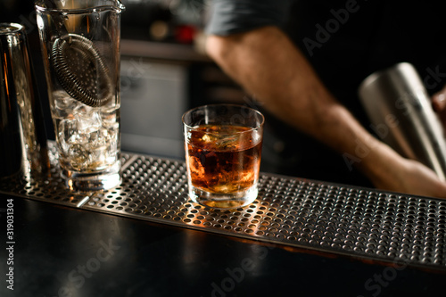 Close-up of whiskey in glass on bar counter