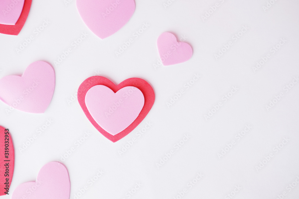 Valentine love concept with red and pink hearts on white background.