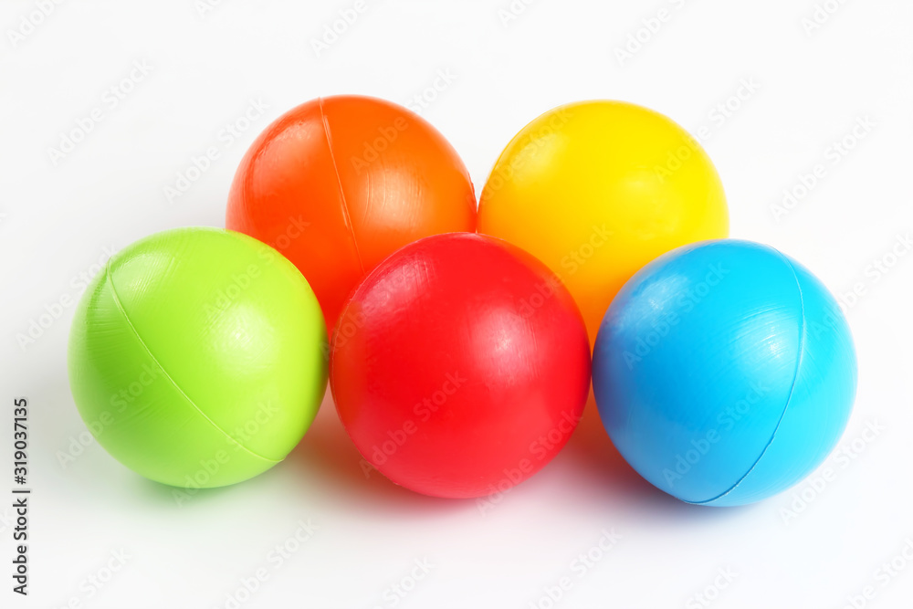 Colored plastic balls on white background. leisure and game items. round objects Colored plastic balls on white background. leisure and game items. round objects