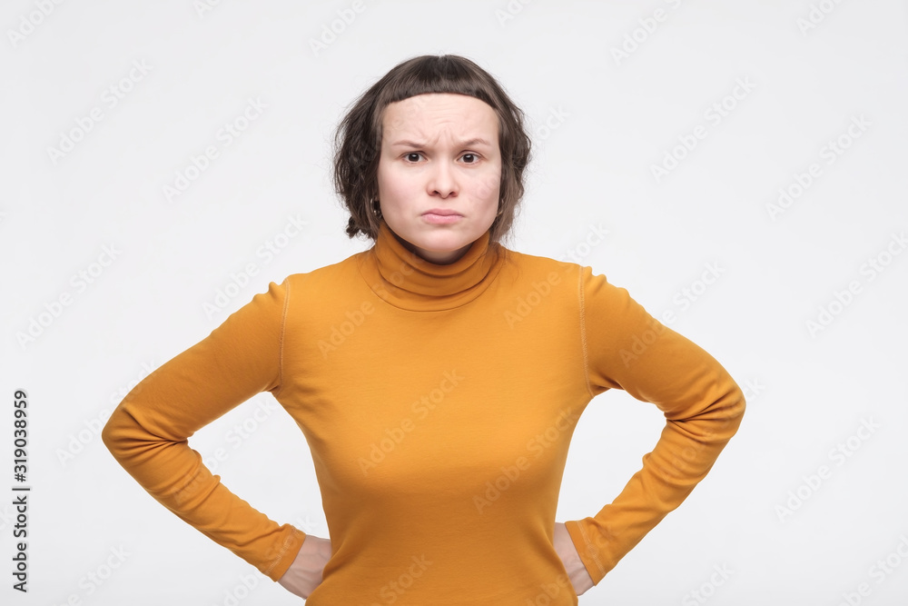 Φωτογραφία Young annoyed female teenager having disappointed unhappy look, frowning