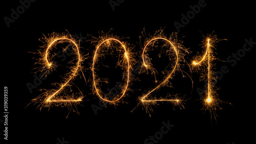 Happy New Year 2021 written with bengal fire, sparkler fireworks candle isolated on a black background. New Year dark background.
