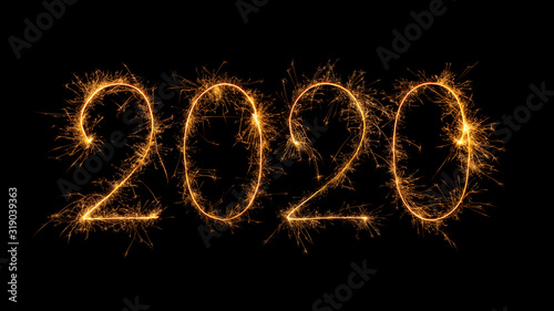 Happy New Year 2020 written with bengal fire, sparkler fireworks candle isolated on a black background. New Year dark backdrop.