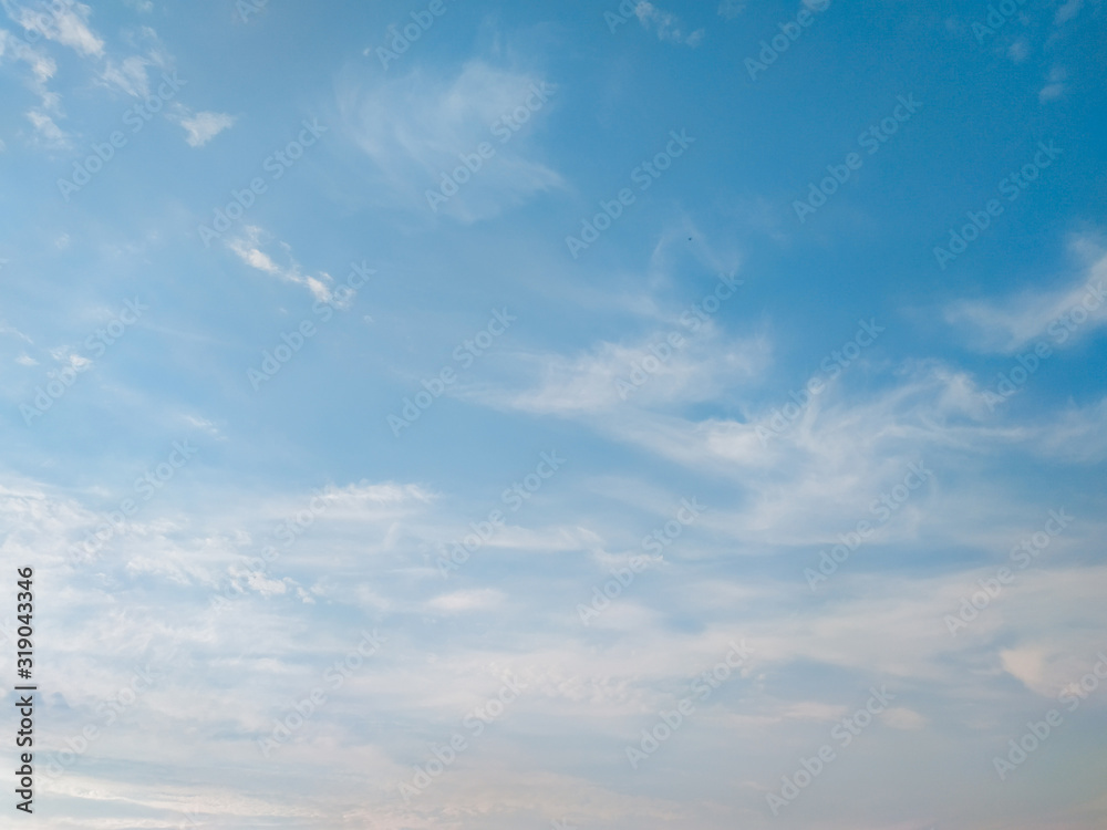 cloudscape with white altocumulus clouds at evening