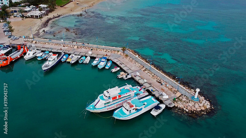 Cyprus Ayia Napa Panorama view of the city on the port by ships in the sea on the coast of the island © Sheviakova