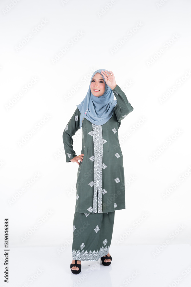 Beautiful female model in various poses wearing modern kebaya and hijab, a modern urban lifestyle apparel for Muslim women isolated on white background. Beauty and hijab fashion concept. Full length.
