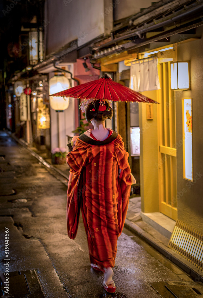 KYOTO, JAPAN - MAY 9, 2017: Geisha walking in Gion, Kyoto Japan