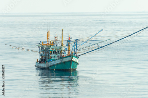 Thai fishing boat use boom and net to catch Schooling fish in the sea