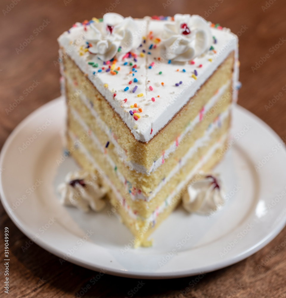 Slice of birthday style layer cake Slice of birthday style layer cake