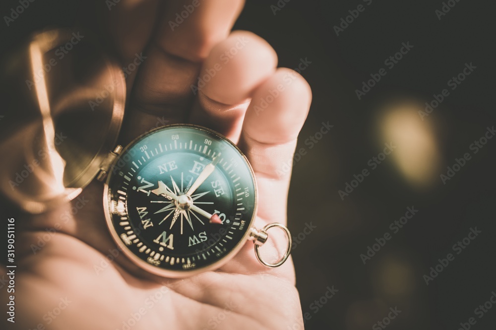 Trail Compass in a Hand Trail Compass in a Hand