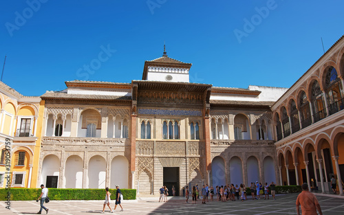 Royal Alcazar Place in Seville, Andalusia, Spain. People on the background