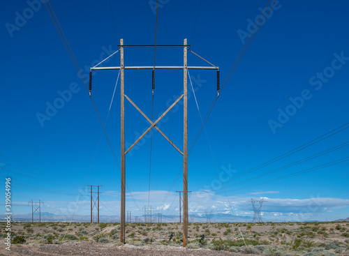 USA, Nevada, Clark County, Las Vegas Valley. A high voltage power transmission line in a utility corridor carrying renewable energy from solar panels.