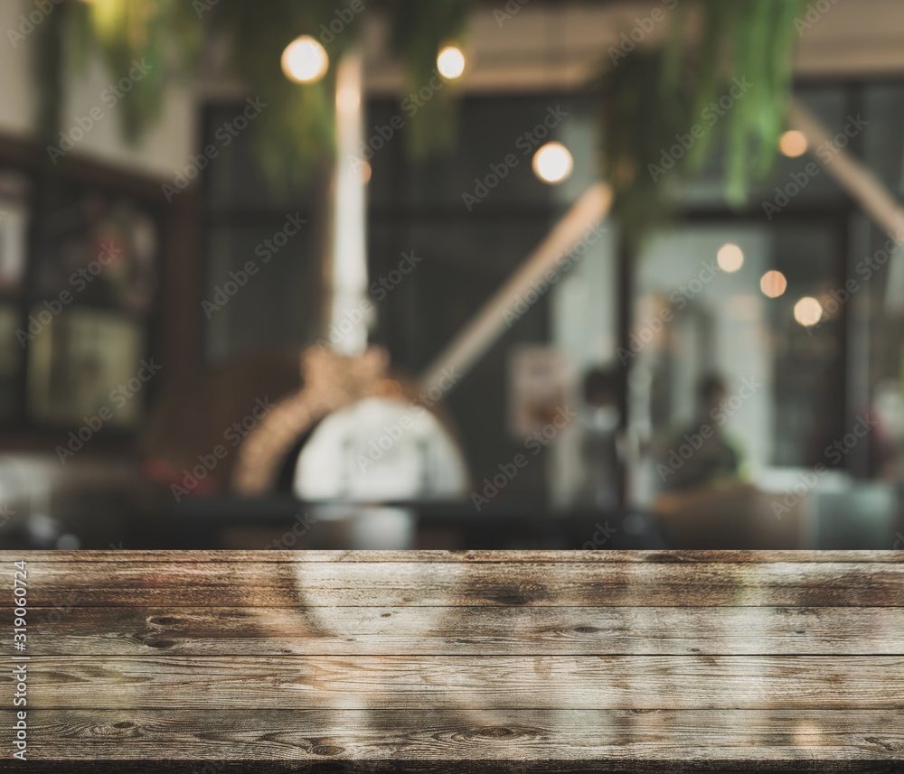 Empty wooden table top with lights bokeh on blur restaurant background - obrazy, fototapety, plakaty 