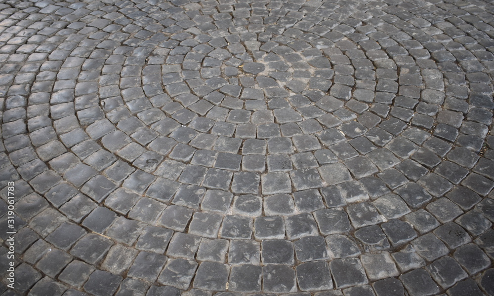 A typical Italian pavement: Sampietrini (or Sanpietrini). Black and white. A typical Italian pavement: Sampietrini (or Sanpietrini). Black and white.