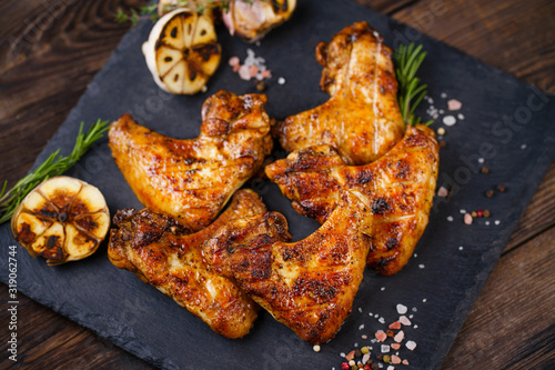 Tasty grilled chicken wings. grill and barbeque, restaurant menu. Delicious beer snack for meat lovers