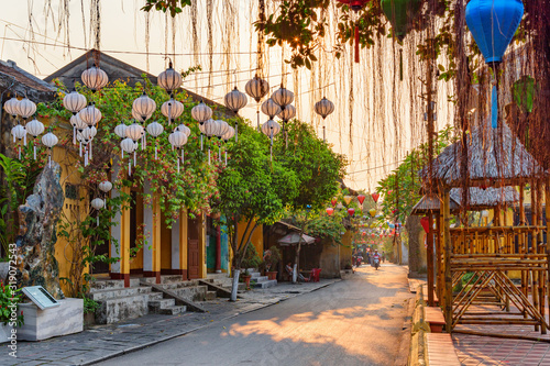 Awesome view of cozy street decorated with silk lanterns photo