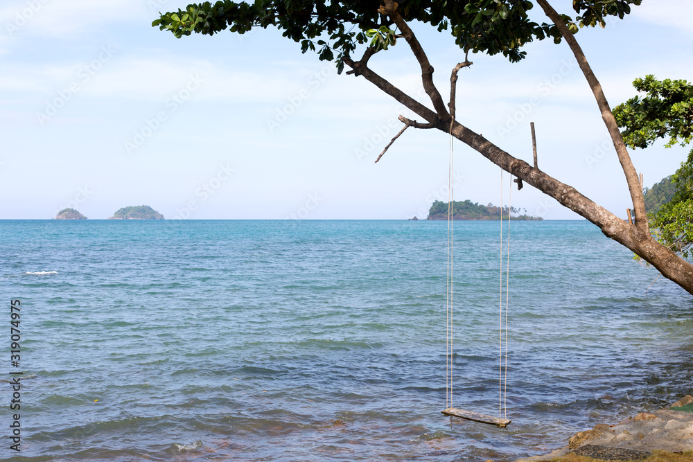 Green leaves on blue sea waves summer background. Green leaves on blue sea waves summer background.