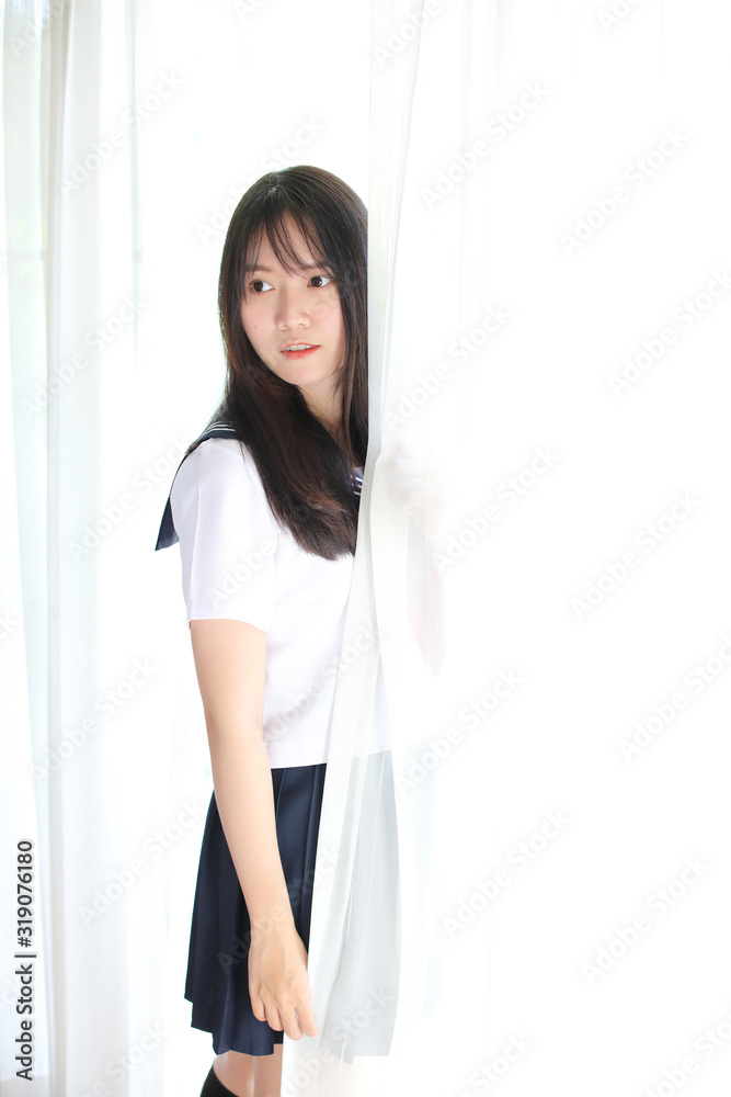 Portrait japanese school girl in white tone bed room Portrait japanese school girl in white tone bed room