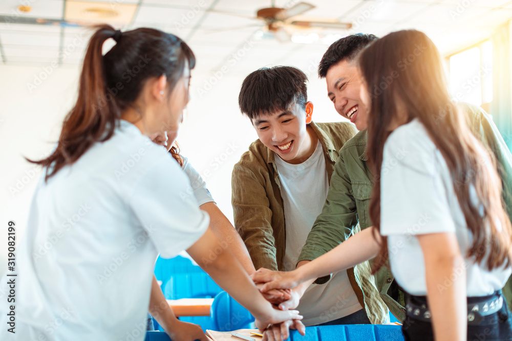 collage Student Putting their Hands on Top of One Another collage Student Putting their Hands on Top of One Another