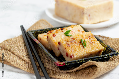 Homemade radish cake with Chinese sausage, popular Chinese dim sum dish photo