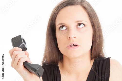 Receptionist rolling eyes at person on other end of the phone
