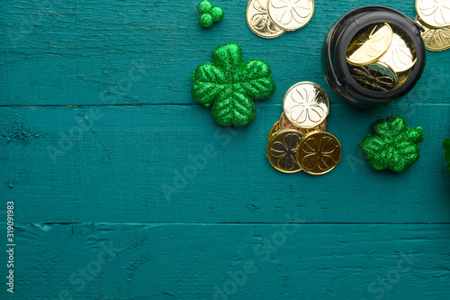 March 17, St. Patrick's Day. Irish holiday, Flat lay green background with coins, clover. Old traditional festivals.