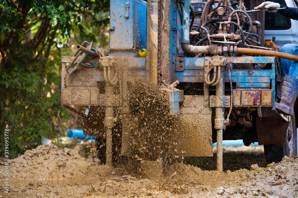 Fototapeta premium ground drilling water machine on old truck drilling in the ground for water