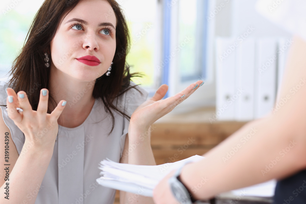 Woman business annoyed at confusion confusion pulling her hands from a lot of paper work does not understand how you can bring as many documents Woman business annoyed at confusion confusion pulling her hands from a lot of paper work does not understand how you can bring as many documents