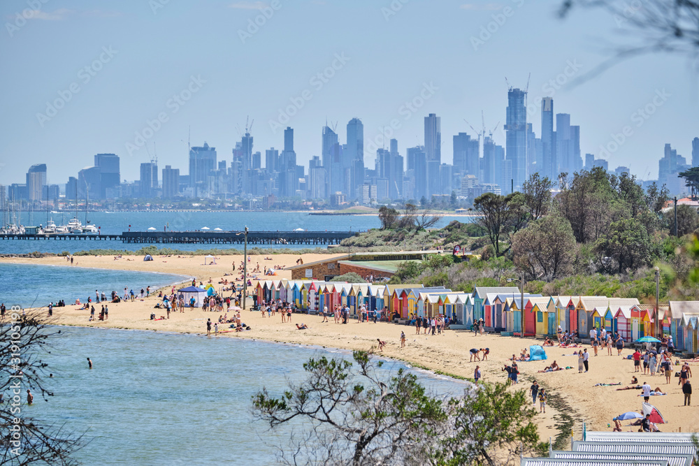 Fototapeta premium Brighton Beach huts/boxes on a blue sky sunny day with bright colours and textures
