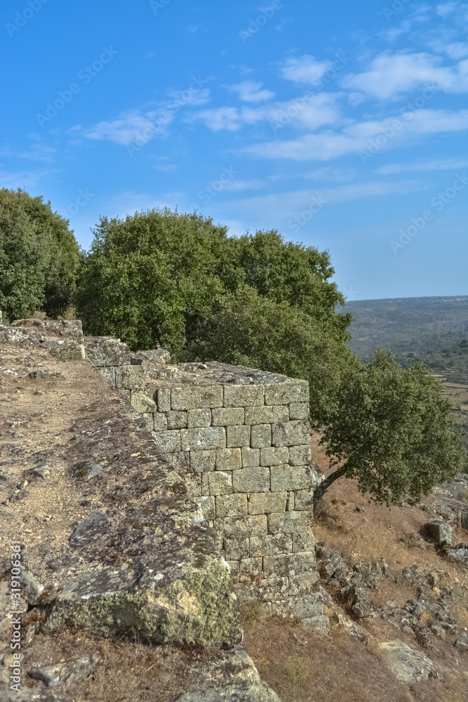 View at the exterior fortress ruins, medieval village inside fortress castle of Castelo Mendo View at the exterior fortress ruins, medieval village inside fortress castle of Castelo Mendo