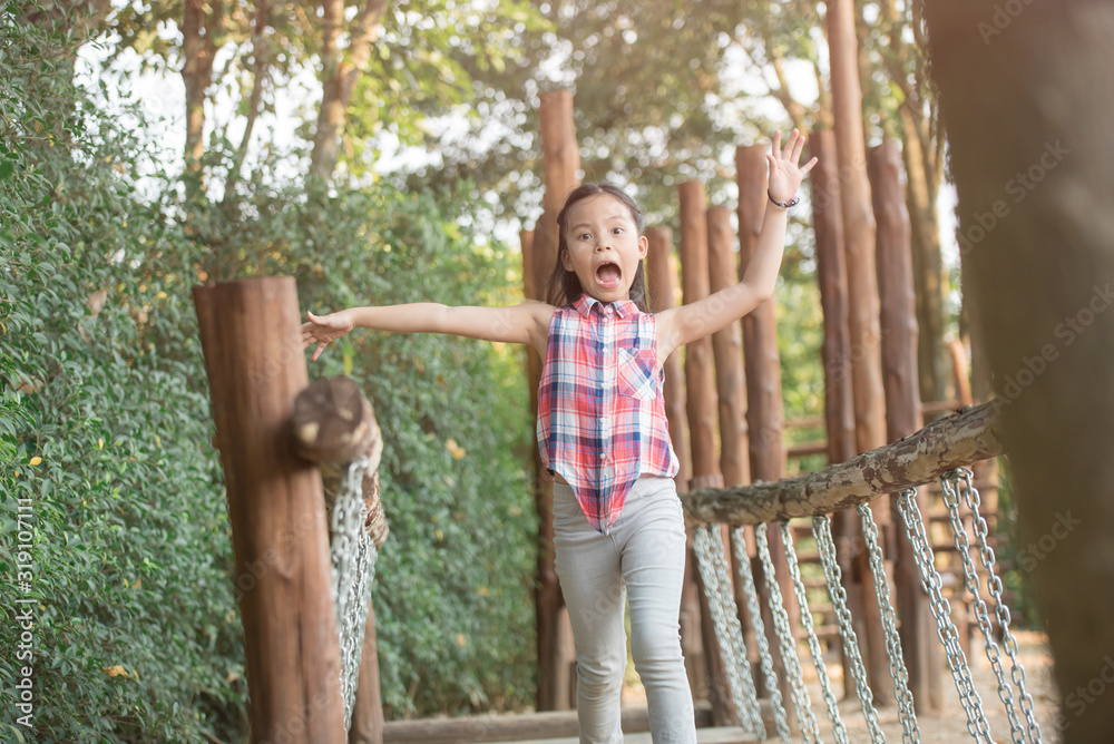 happy little asian girl child having fun to playing in the playground in summer time with smile and laughing healthy, funny smiling face adorable lovely female kid. happy vacation lifestyle concept. happy little asian girl child having fun to playing in the playground in summer time with smile and laughing healthy, funny smiling face adorable lovely female kid. happy vacation lifestyle concept.